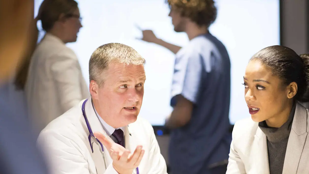 Doctors discussing a case in a hospital.