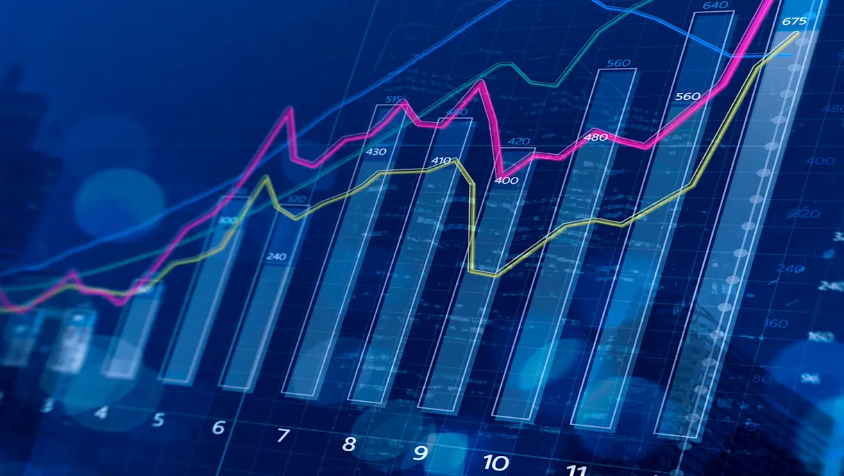 Financial growth chart with rising bar and line graphs over a city skyline, representing business performance and market growth.