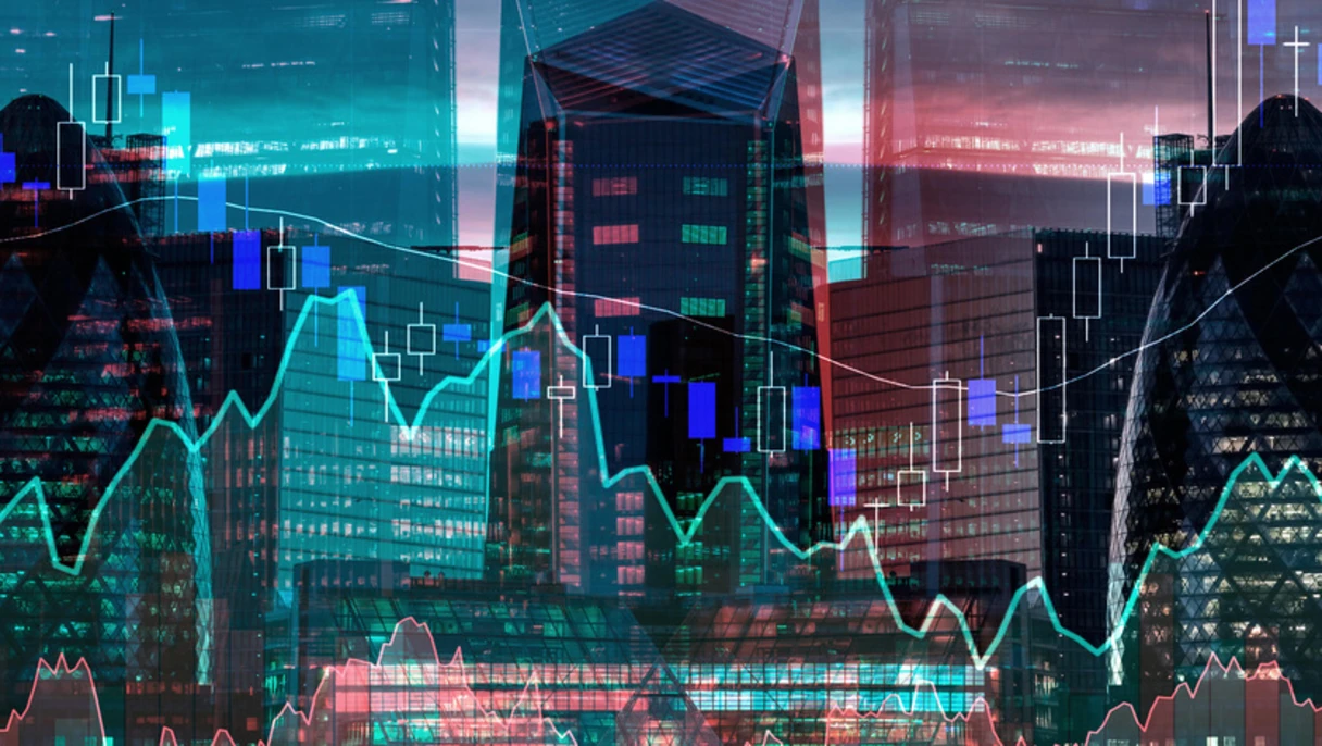 City skyline with stock market charts