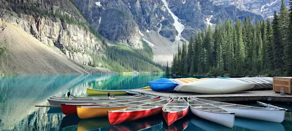 Canoes on a Jetty at Moraine Lake, Banff National Park in the Rocky Mountains, Alberta, Canada