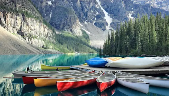 Canoes on a Jetty at Moraine Lake, Banff National Park in the Rocky Mountains, Alberta, Canada