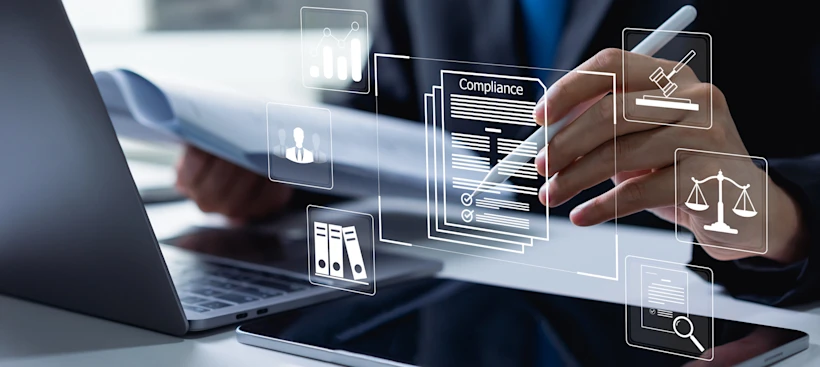 A hand holding a stylus over a digital compliance document, surrounded by floating icons including charts, scales and legal symbols.