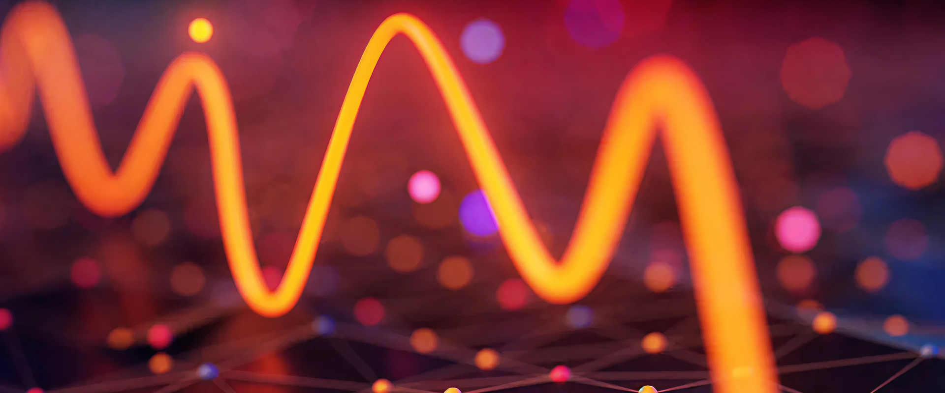 Glowing orange wavy line over a dark background with scattered small colorful dots and faint network connections.