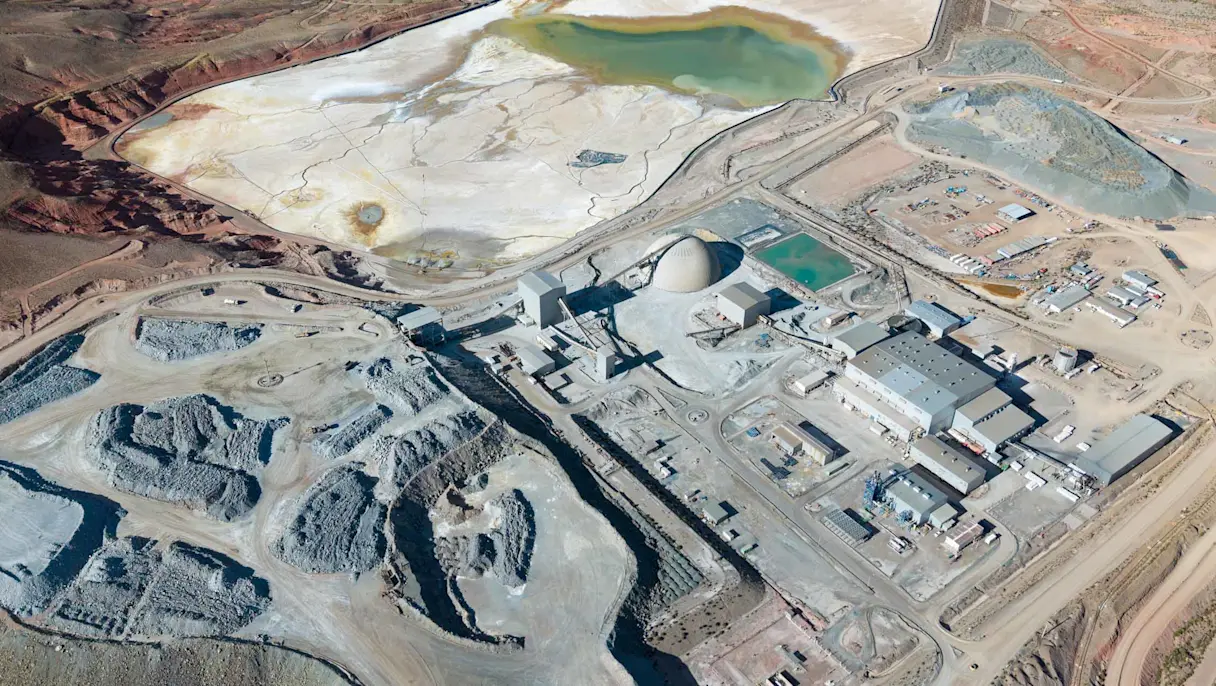 Aerial view of desert mining facility and tailings pond