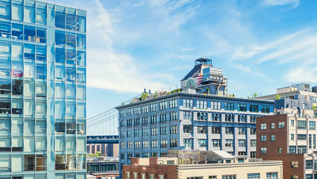 residential and commercial buildings in the Dumbo district of Brooklyn, New York, with the Manhattan Bridge in the background