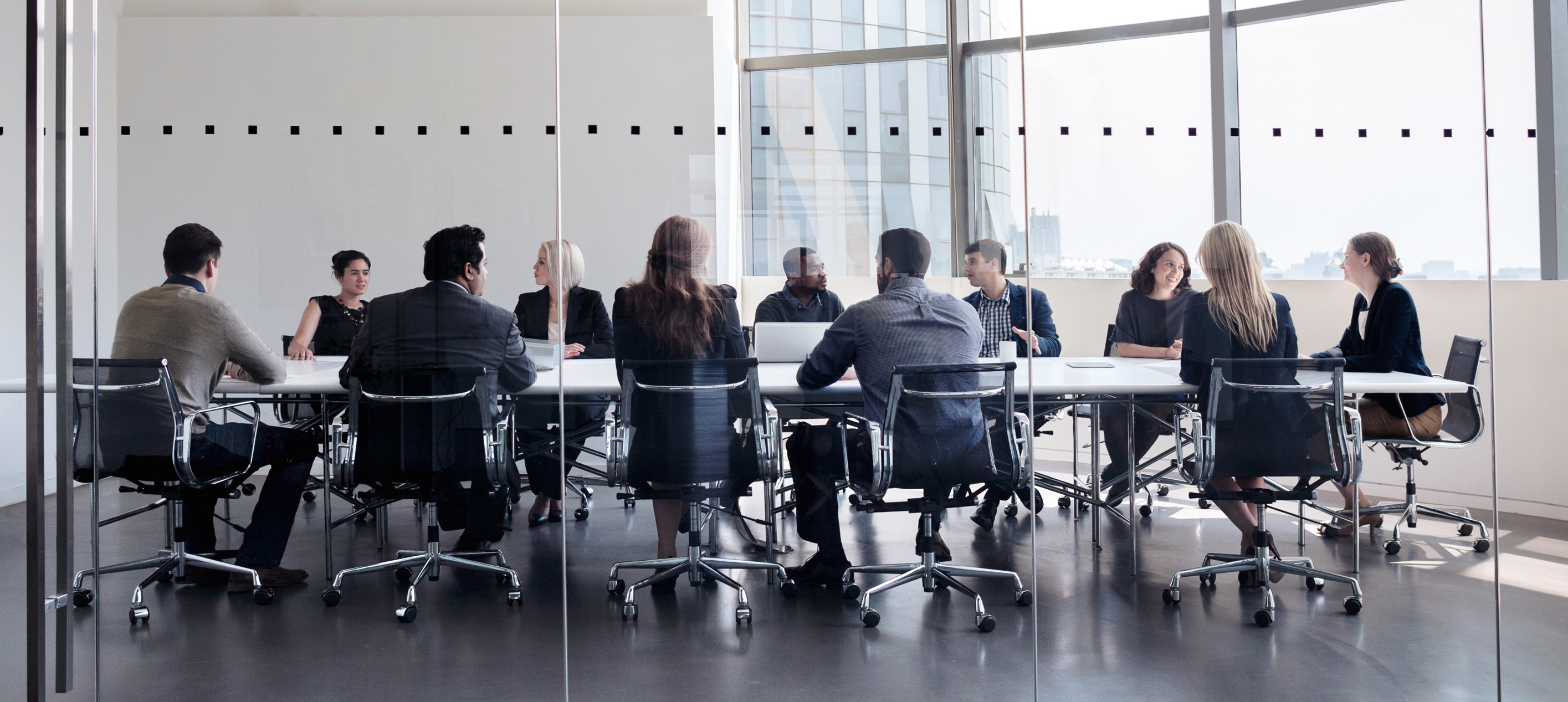 Business professionals collaborating in a modern office meeting room