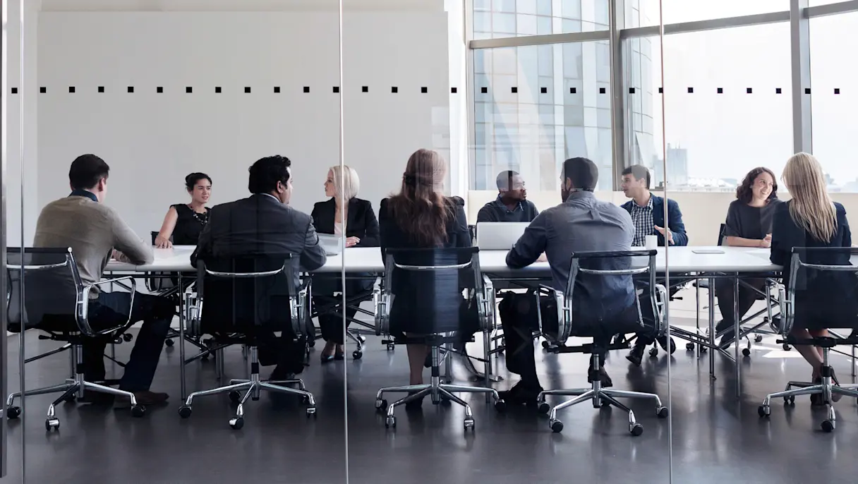 Business professionals collaborating in a modern office meeting room