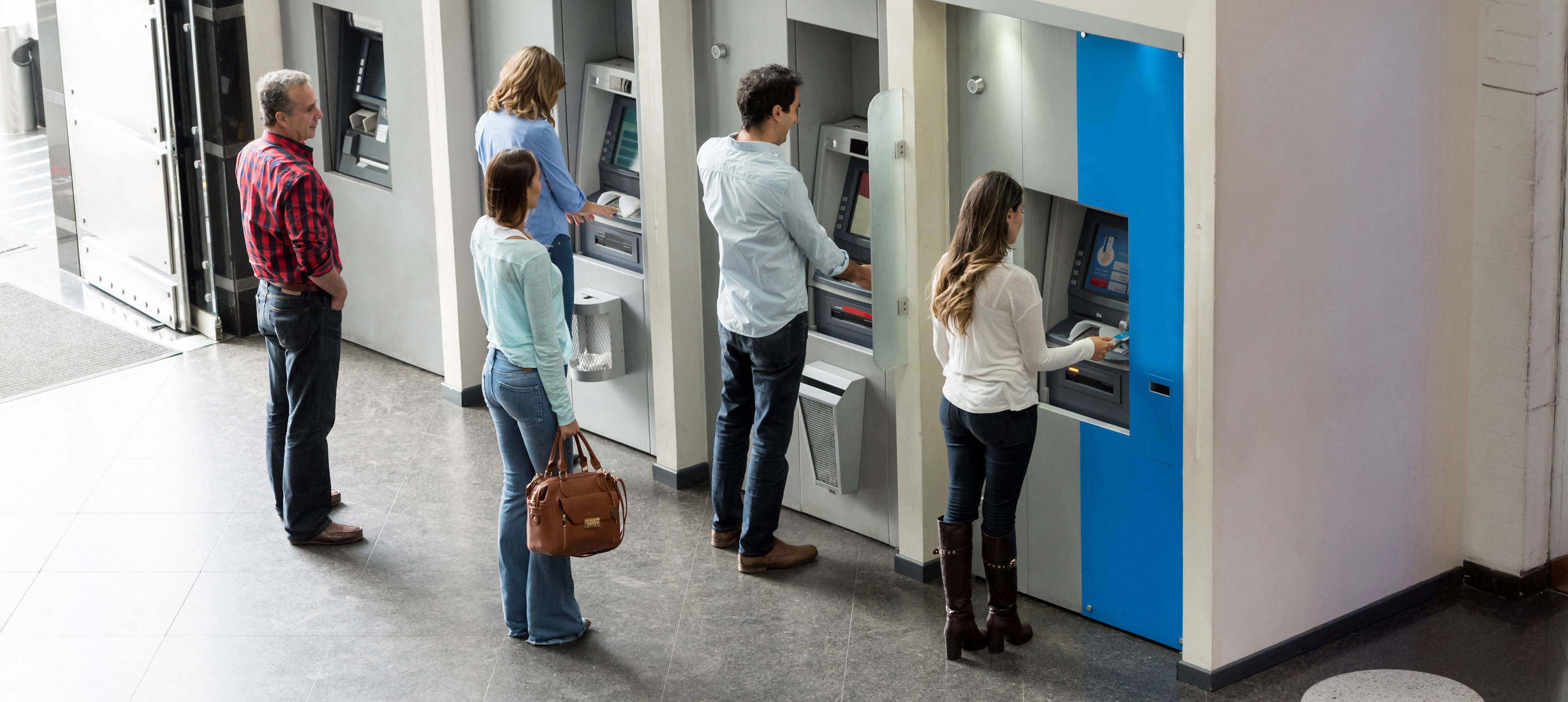 Customers standing in line for the ATM