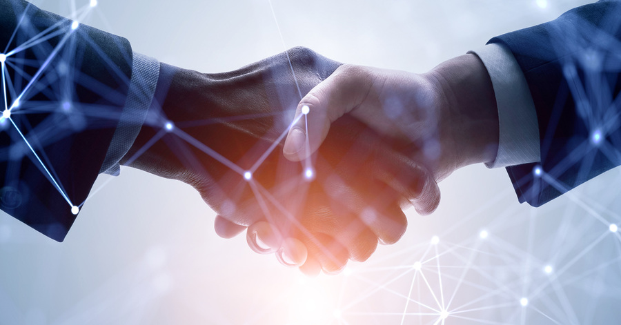 Business handshake with digital network overlay