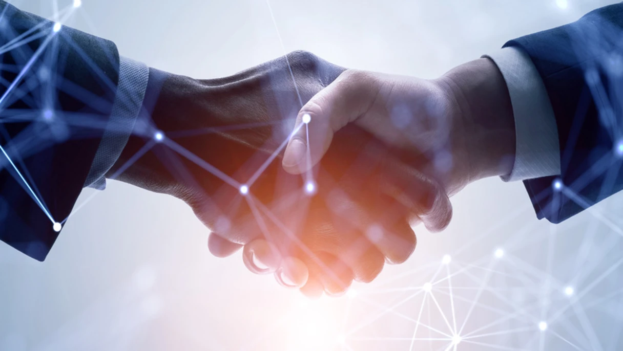 Business handshake with digital network overlay