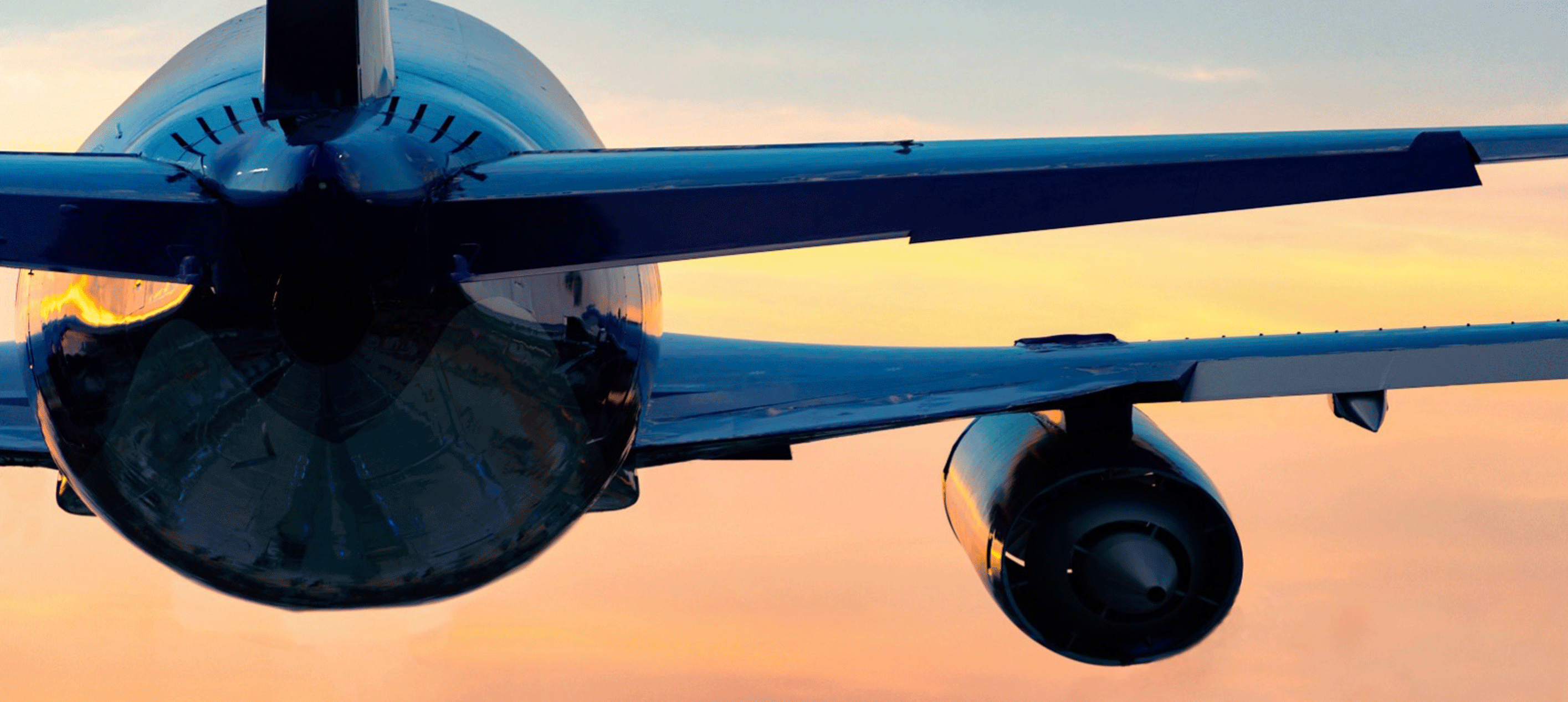 A Close up of an Airplane's Right Wing and Engine