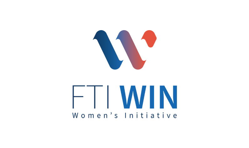 FTI WIN logo featuring a stylized 'W' in blue and red gradient above the text 'FTI WIN' with 'Women's Initiative' written below on a white background.