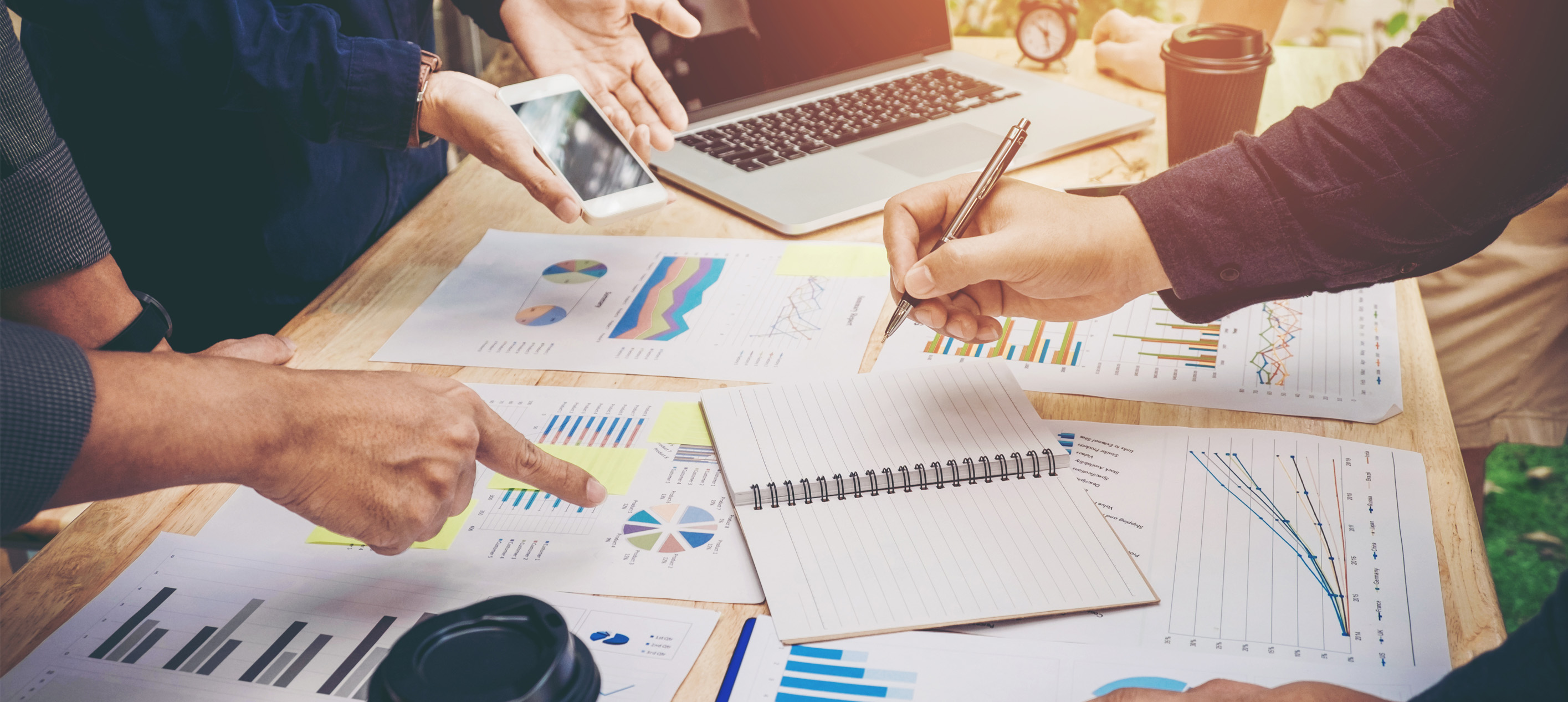 business meeting scene focused on data analysis and strategic planning
