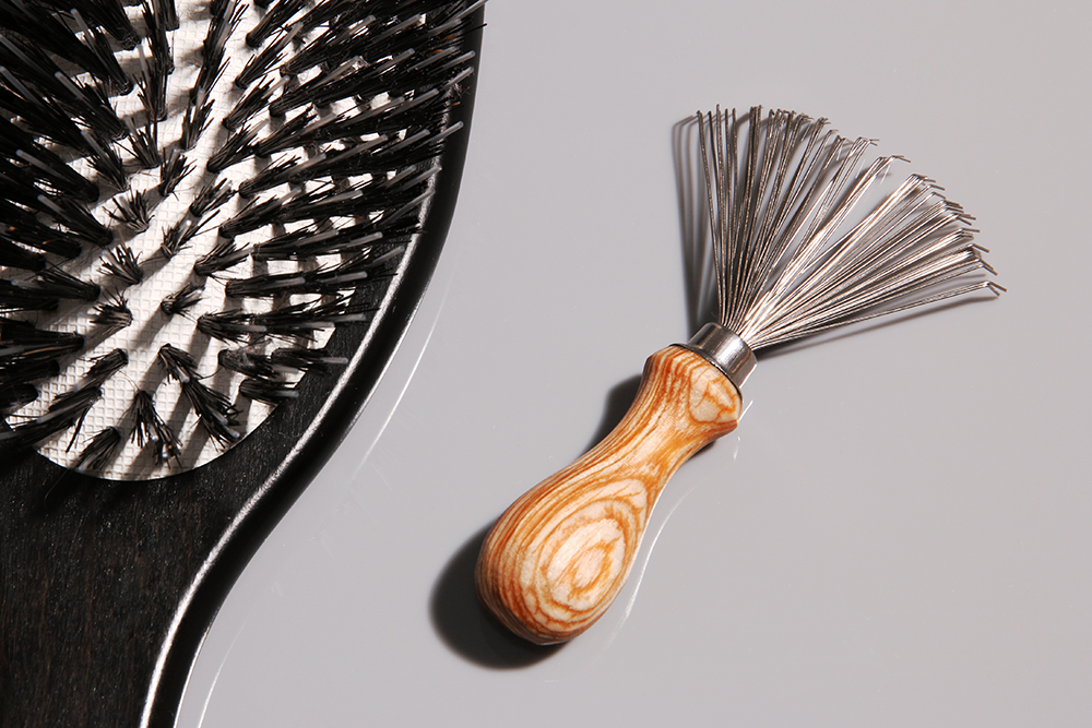 You're Probably Not Cleaning Your Hairbrush As Often As You Should Be