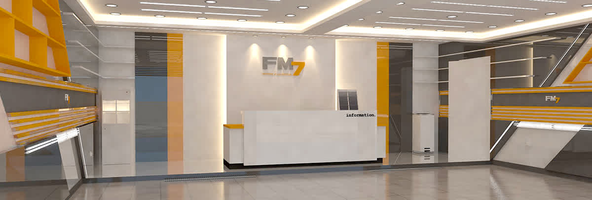 Modern information desk area with FM7 logo and orange-gray decor.