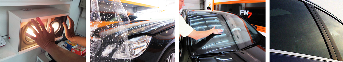 Hands removing film from a car window; car wash and automotive maintenance scene