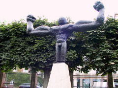Sculpture of a man form showing his muscles 