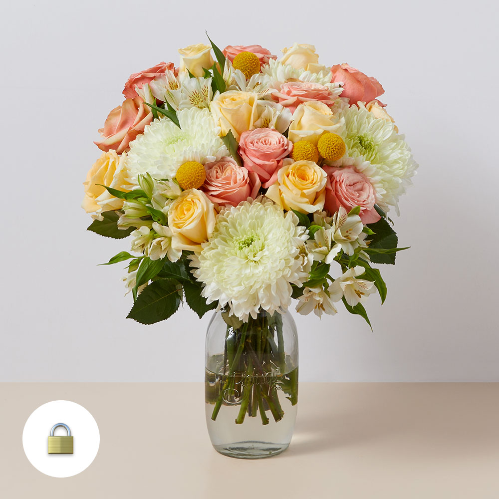 Mixed bouquet in white, peach and yellow iwth roses and mums