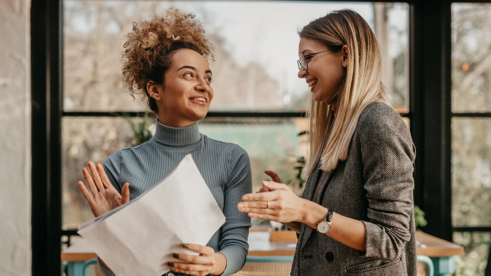 Two young women with documents