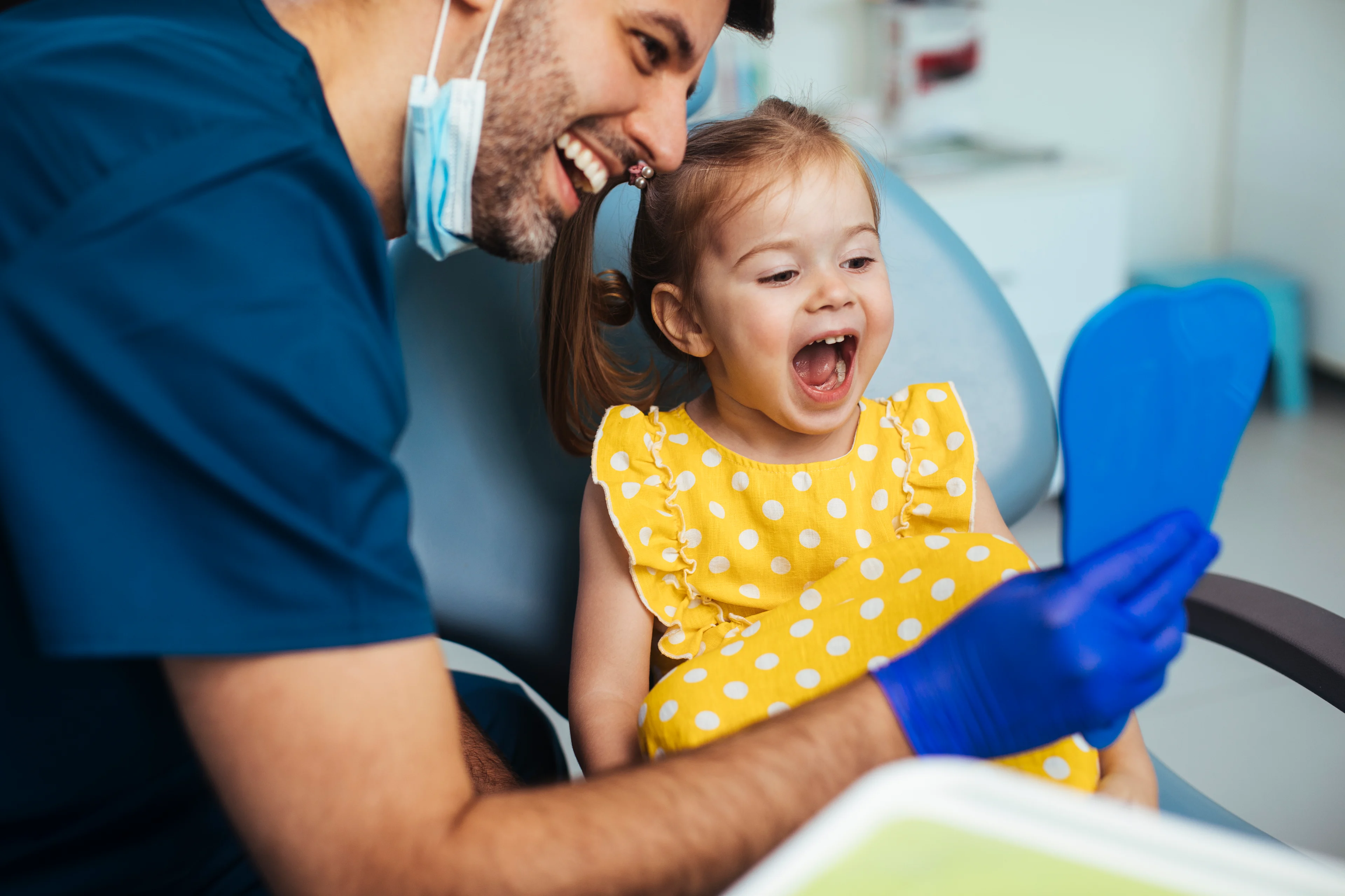 Dentist with a little girl patient.