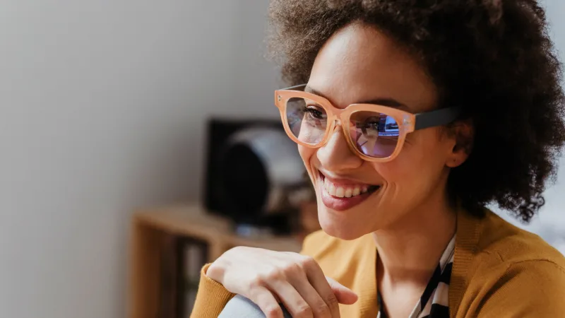 A workplace plan - Woman in glasses smiling warmly