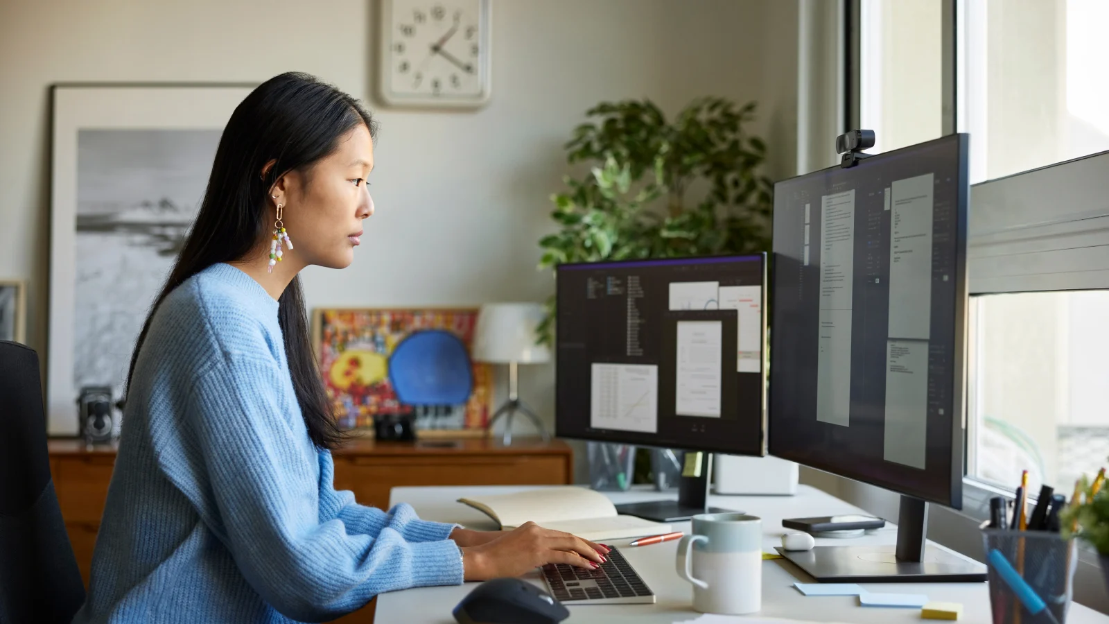 Woman in front of her computer monitor.