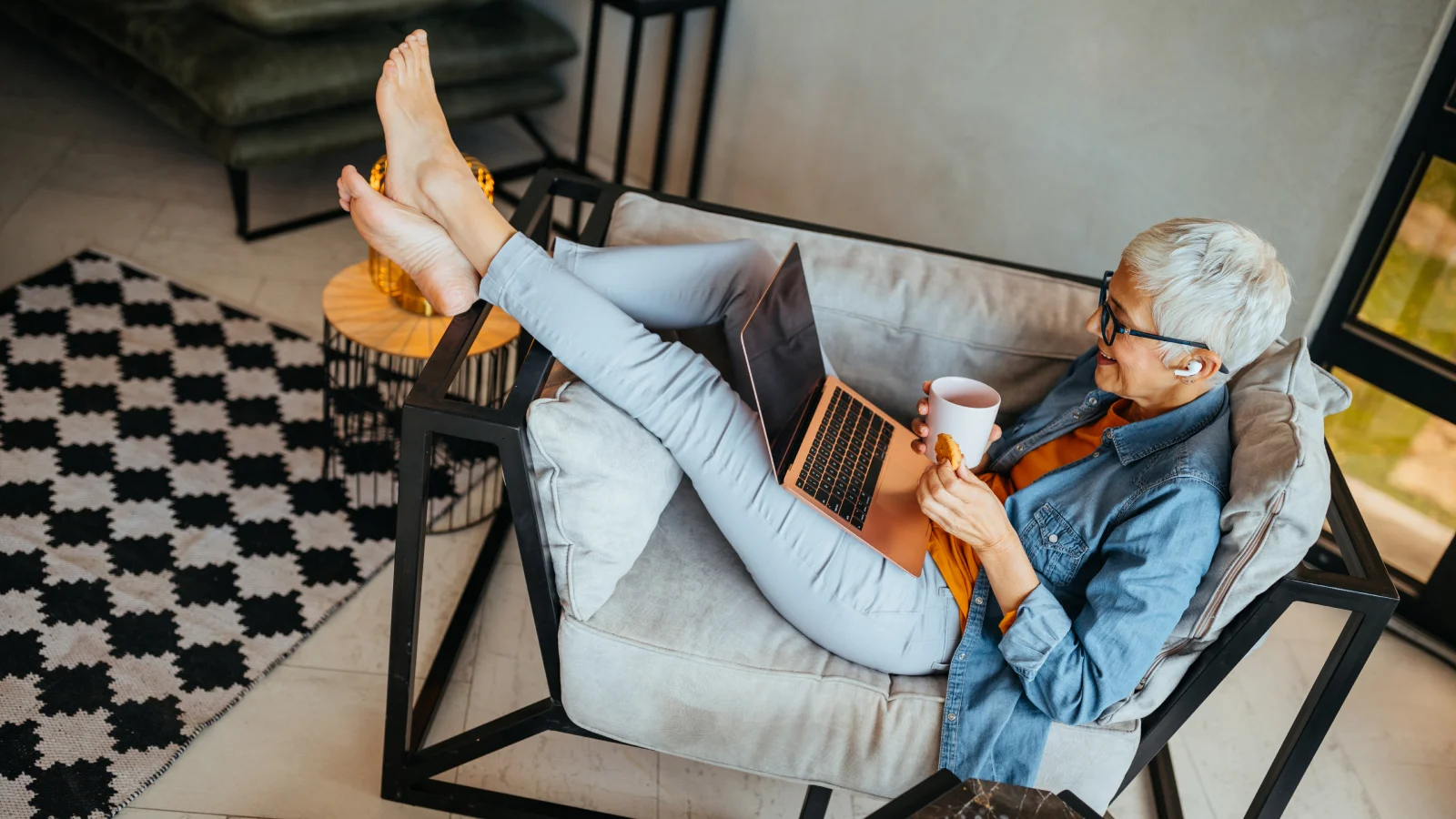 A strategy for retirement - woman researching her retirement needs on the laptop