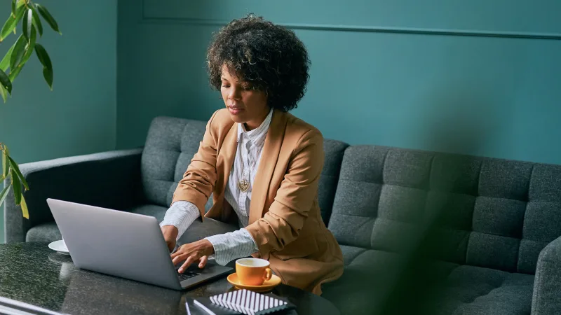 Steps to building a financially secure future - Woman researching financial options to strengthen her portfolio