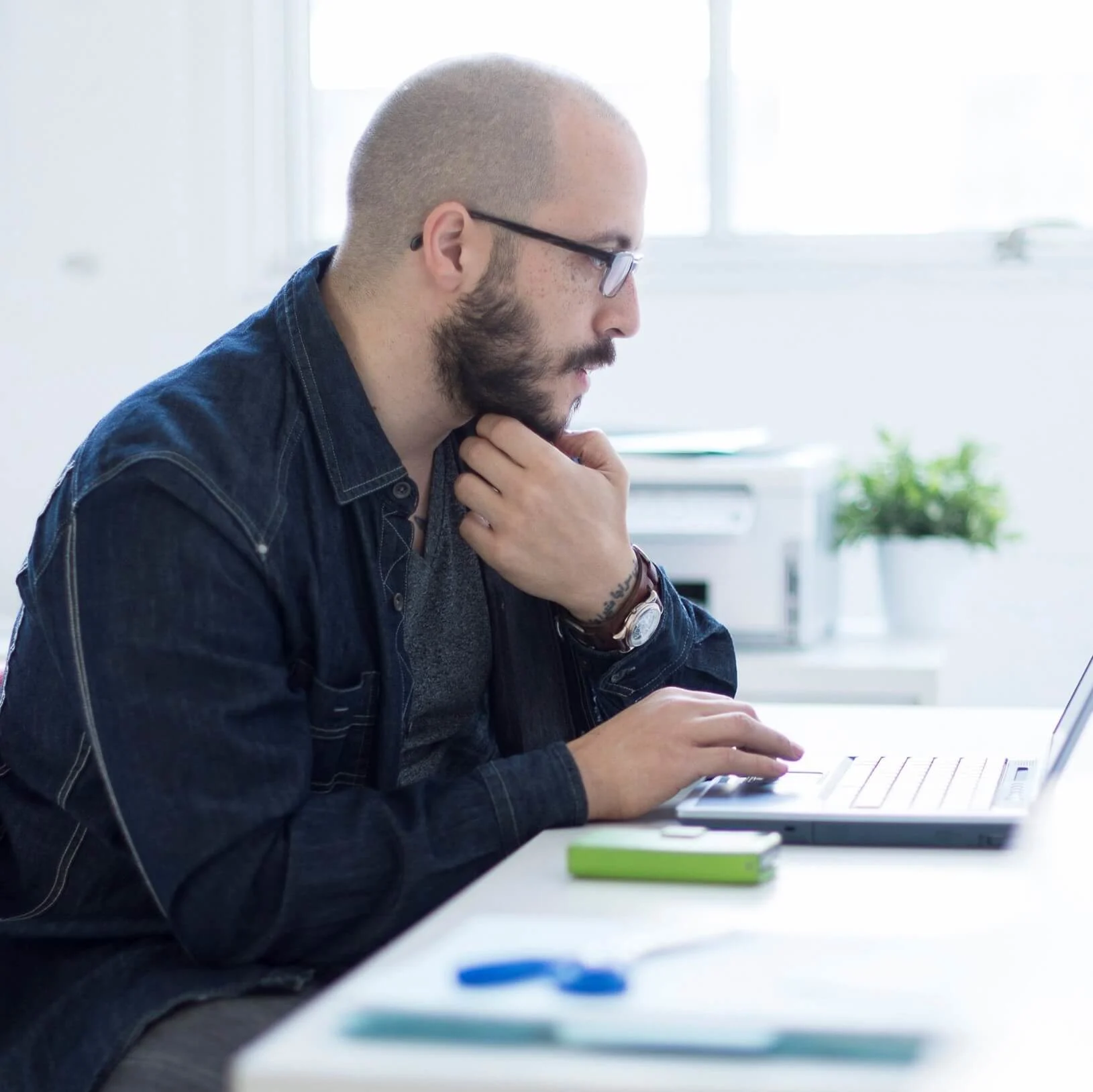 Man working on his laptop at home