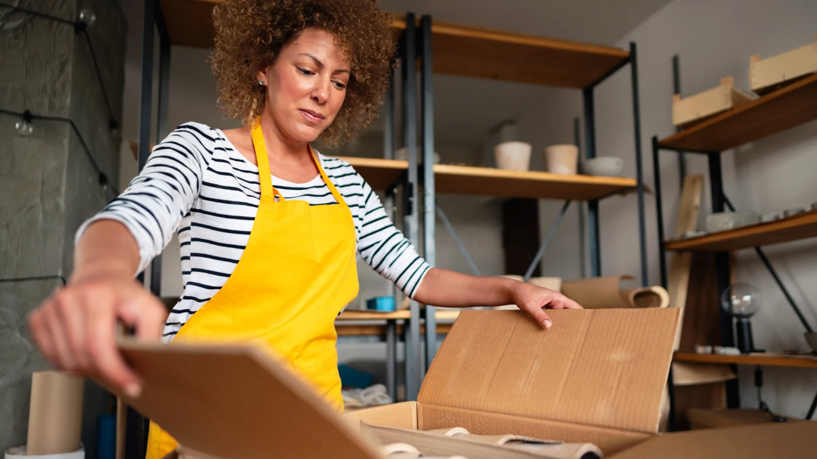 Woman opening box
