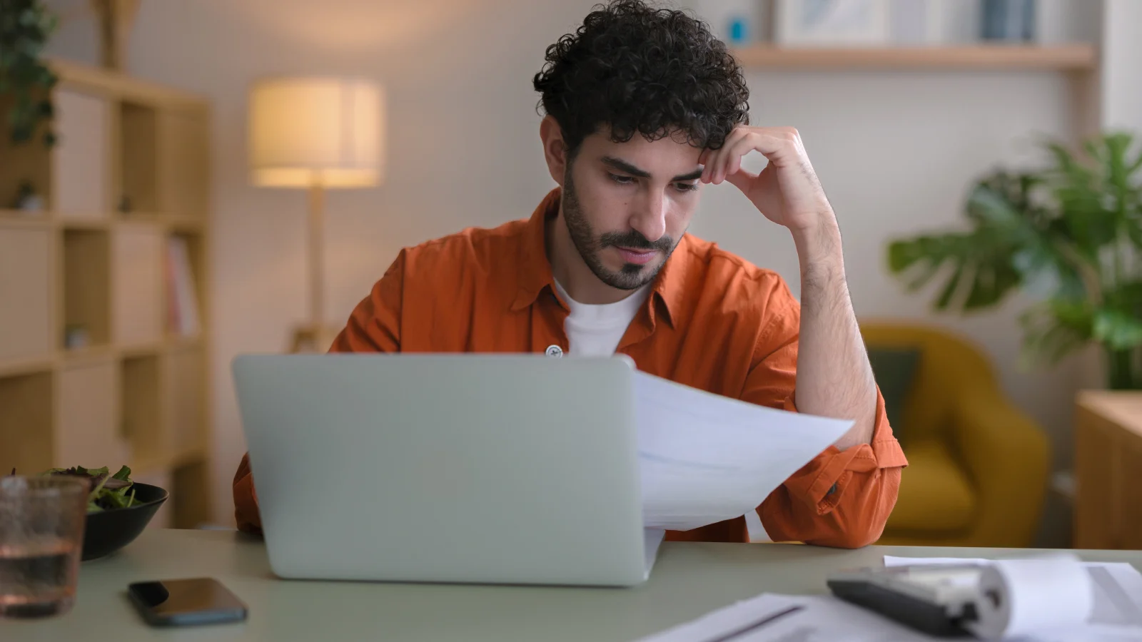 Man reviewing household bills