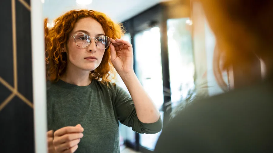 Vision insurance - Woman trying on glasses