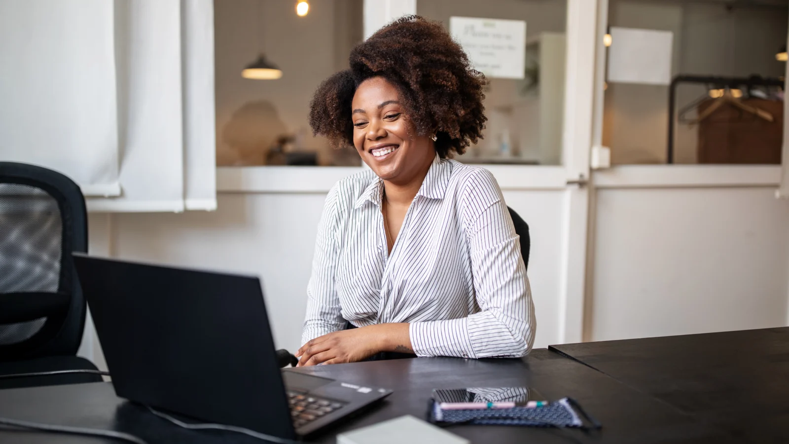 Woman working from an office.