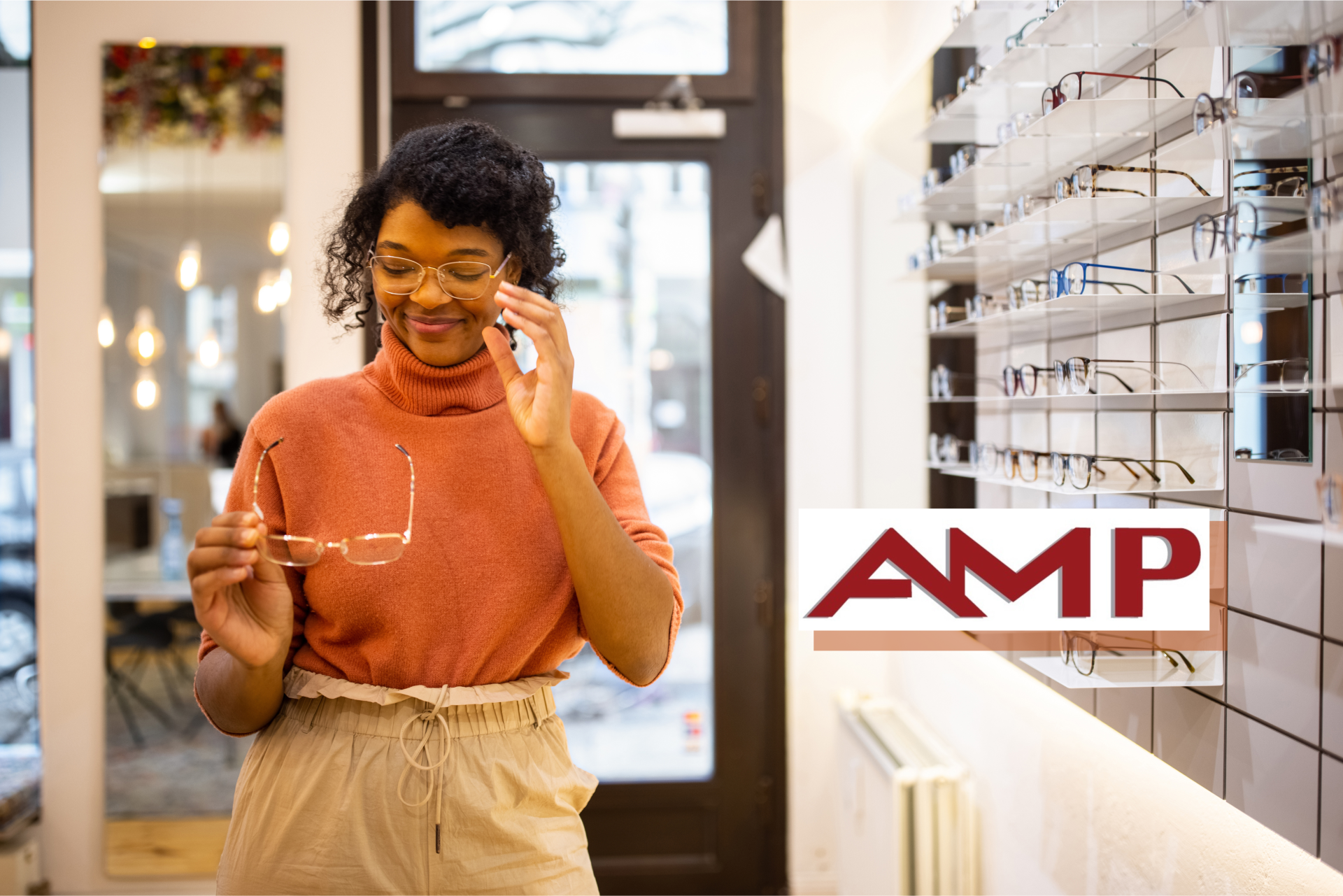 Woman shopping for glasses with AMP logo