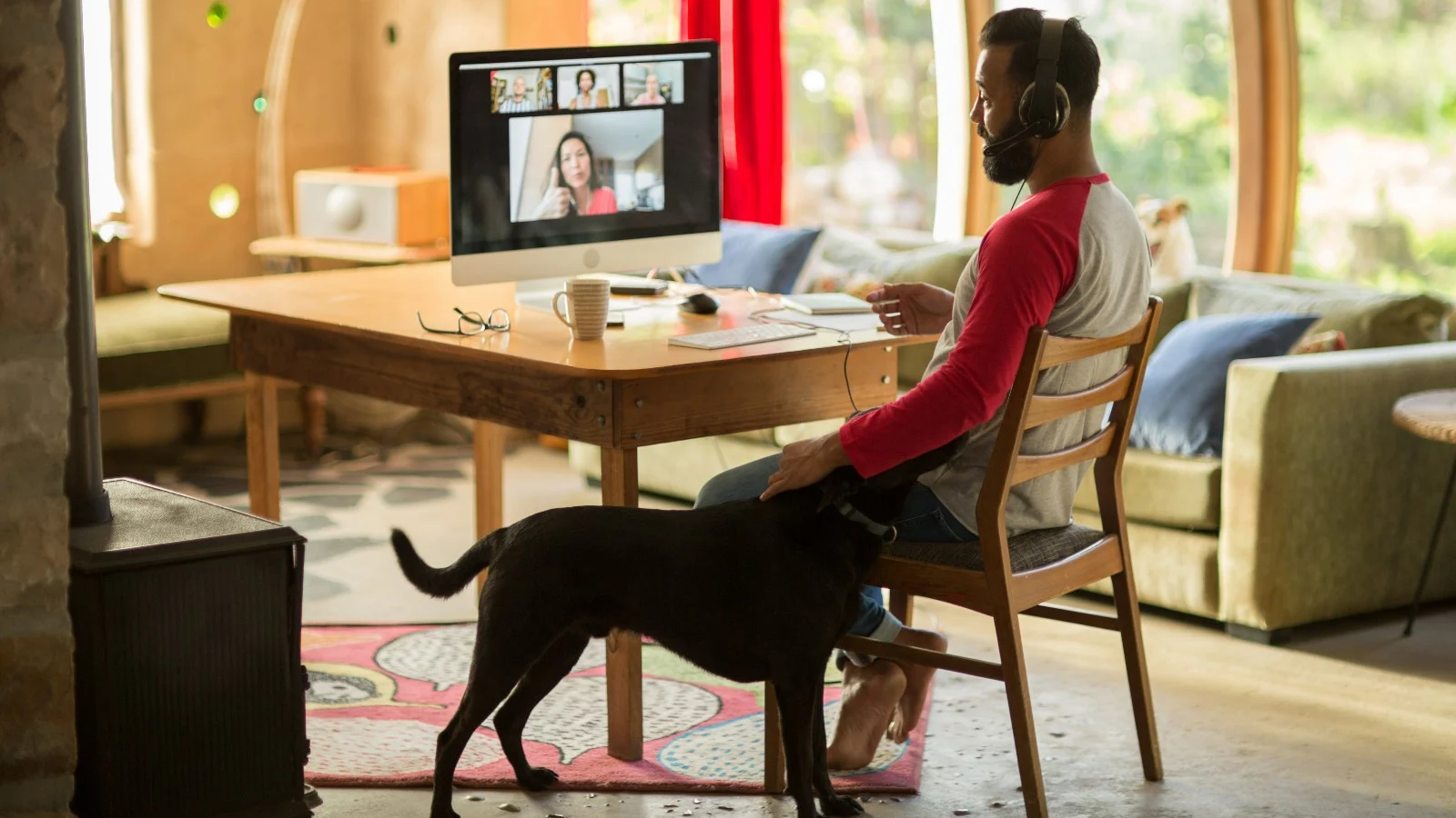 mixed race man working from home on his computer during lockdown