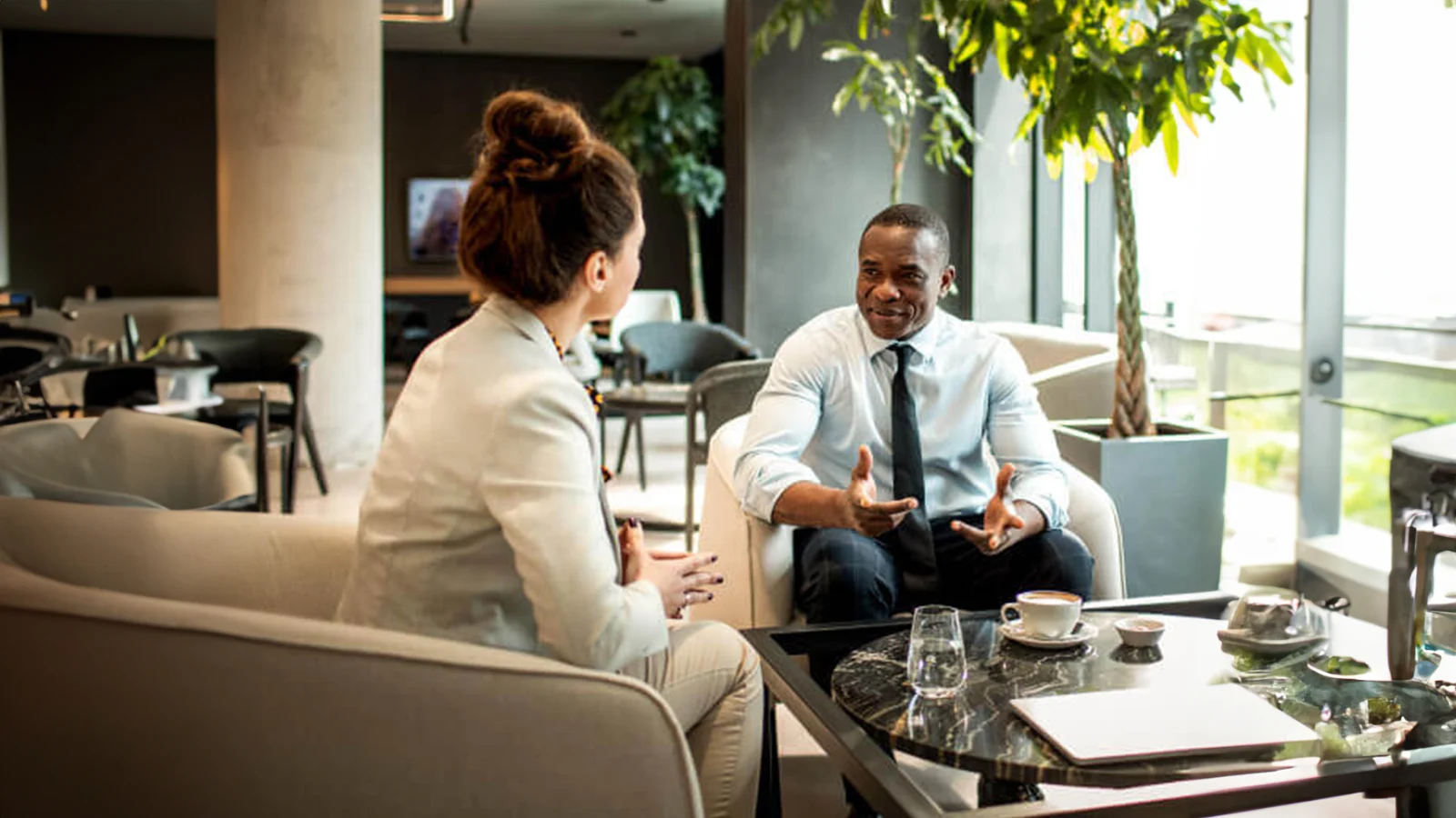 A financial representative talking to her client