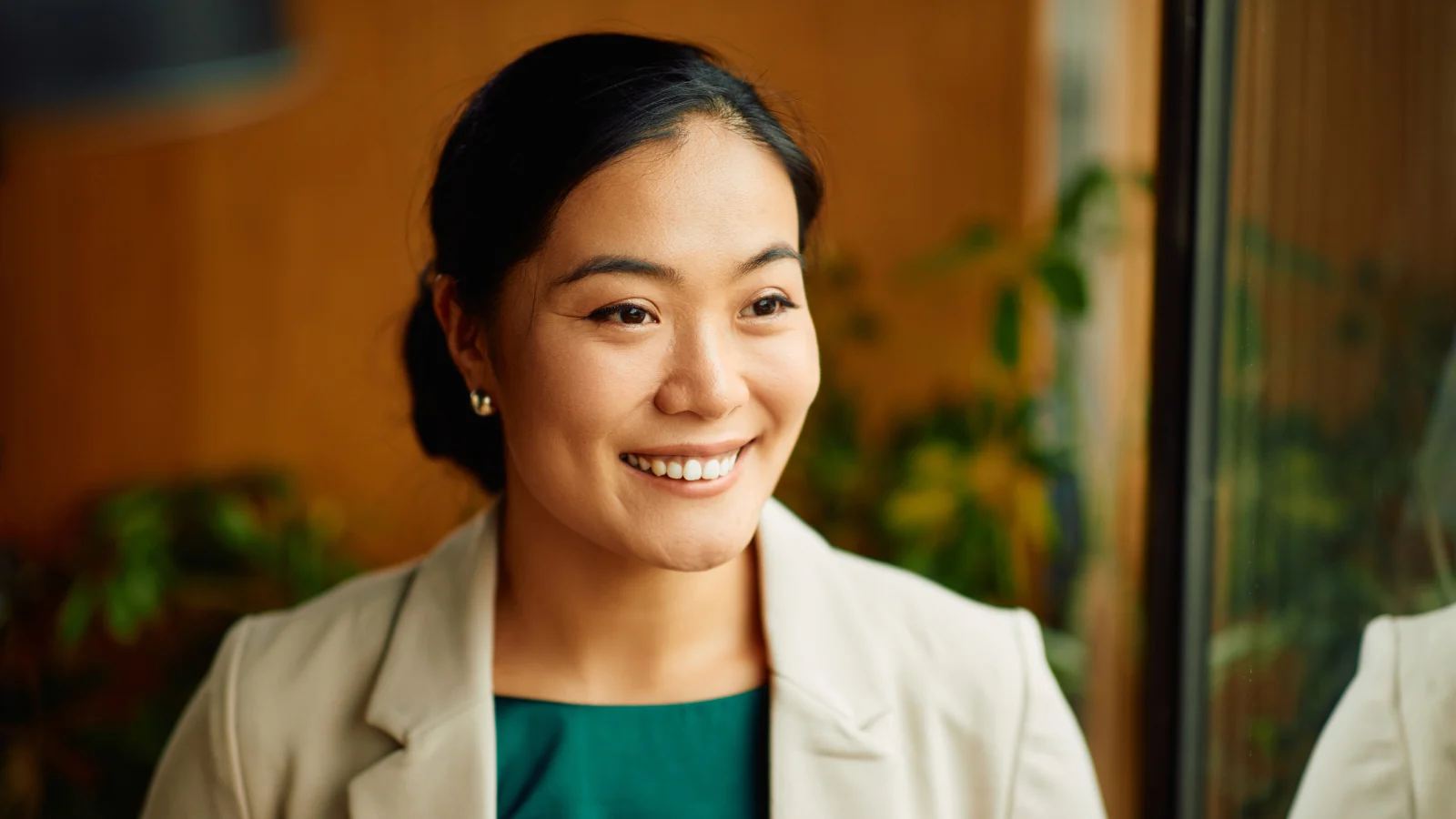 Businesswoman smiling in an office.