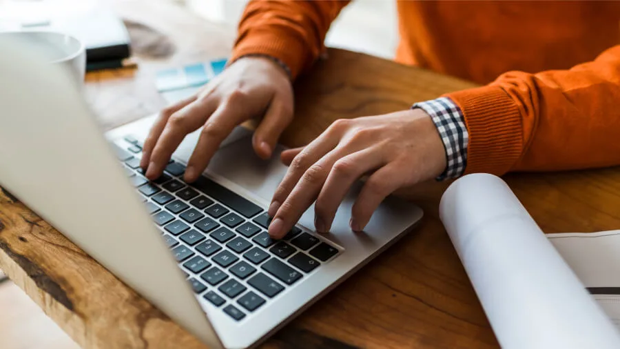 Person typing on a laptop