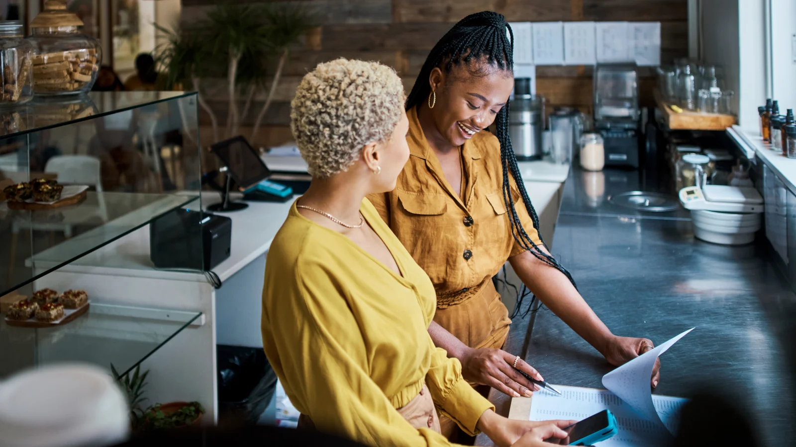 Two businesswomen discussing their workplace