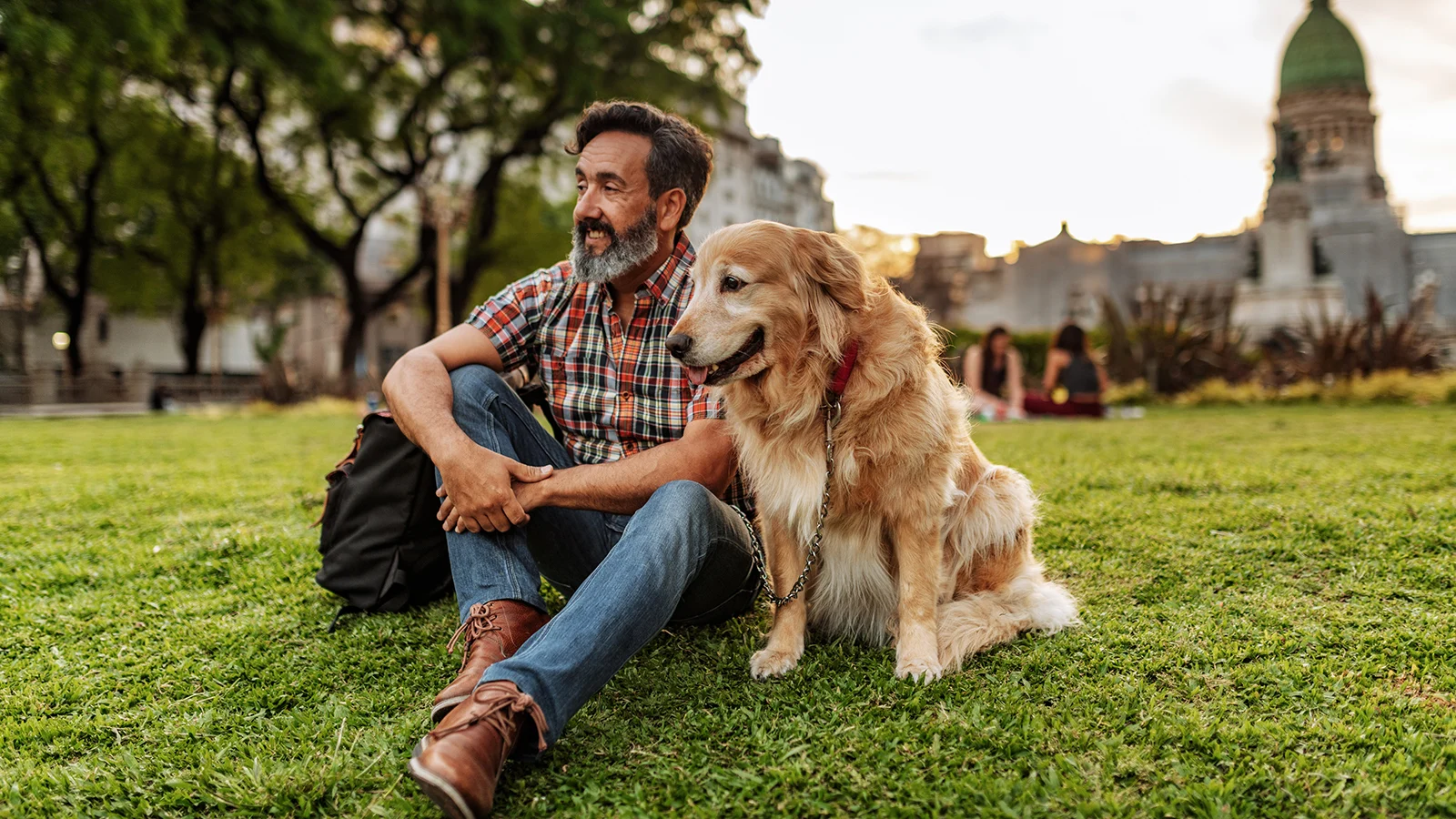 man-with-dog-on-lawn