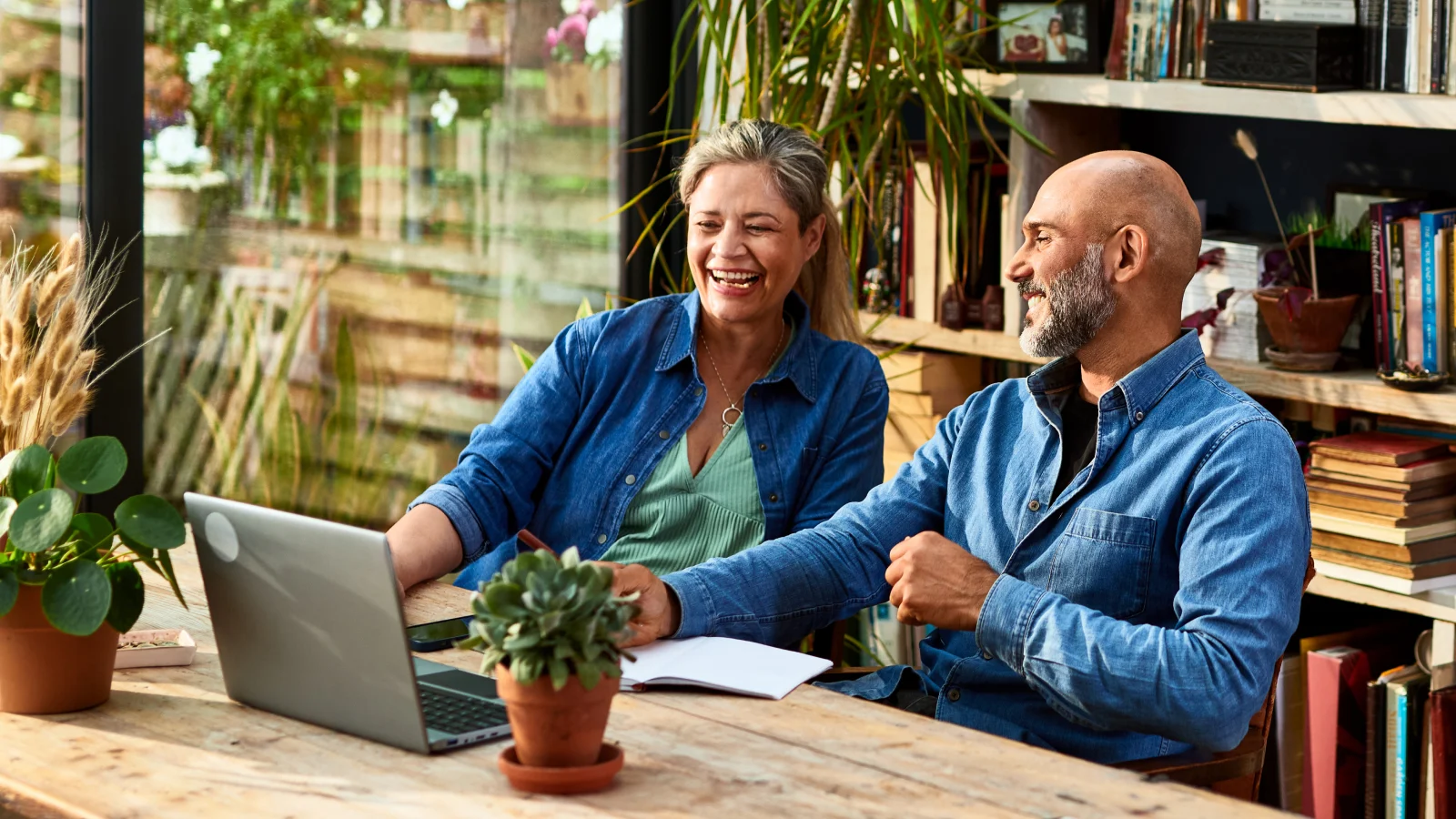 Husband and wife looking at a laptop together