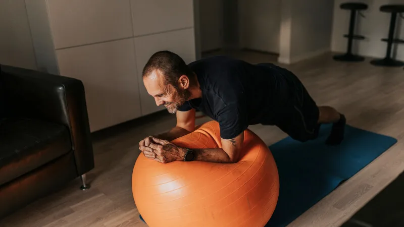 Man planking doing physical therapy