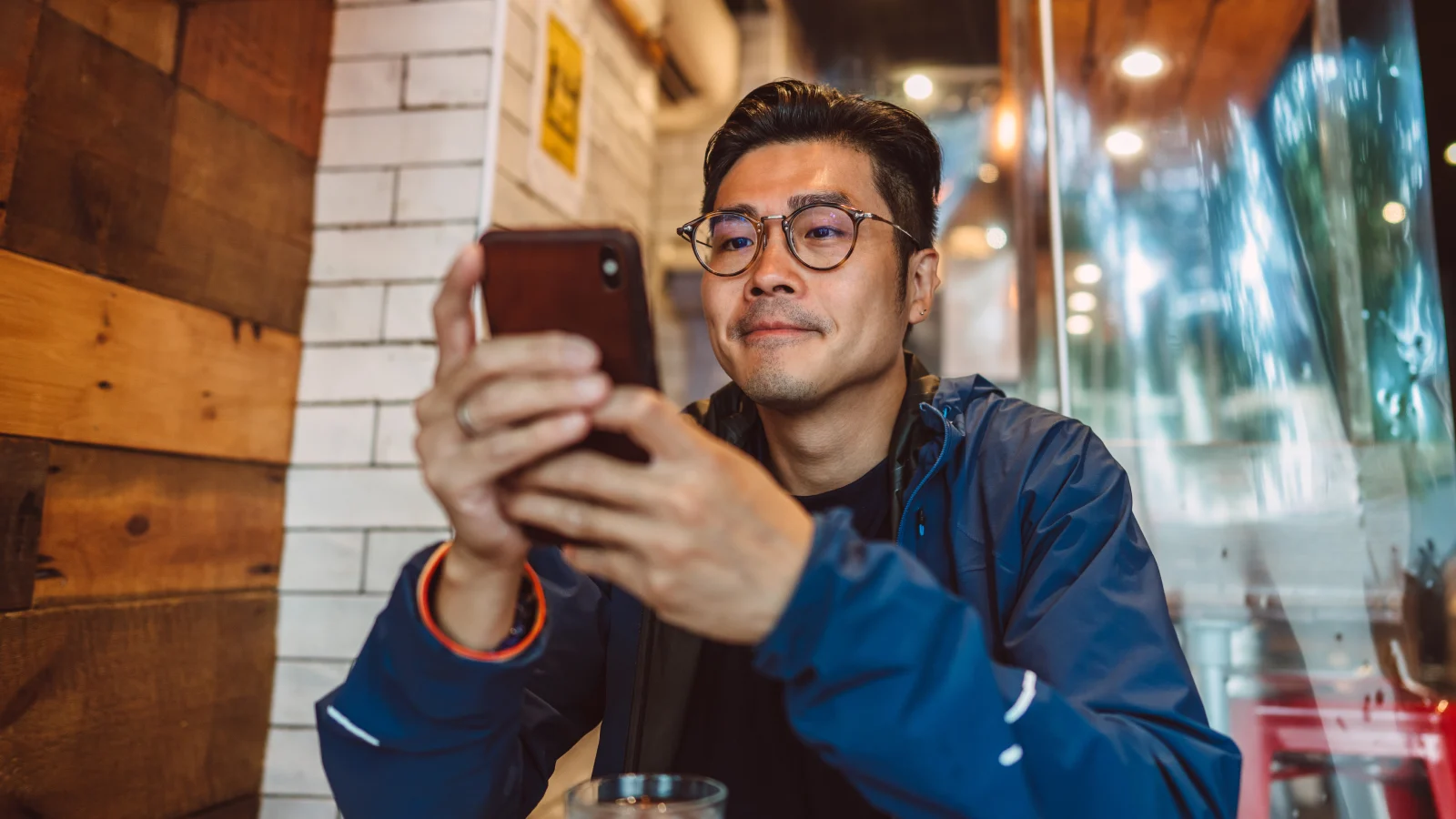 Man looking at a notification on his cell phone.