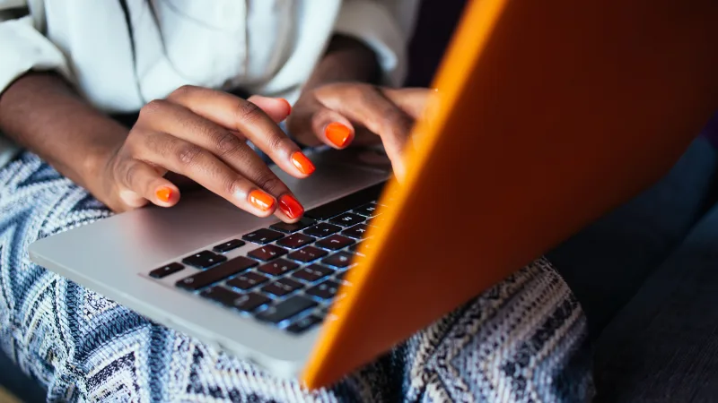 Starting to think about retirement? Try our retirement planner - Woman hands typing on a laptop