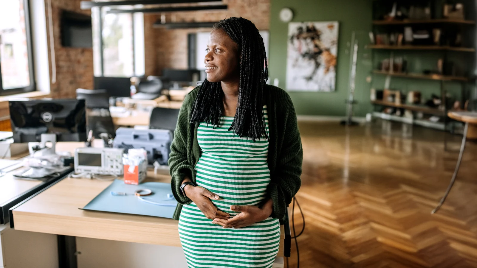 Pregnant woman in an office.