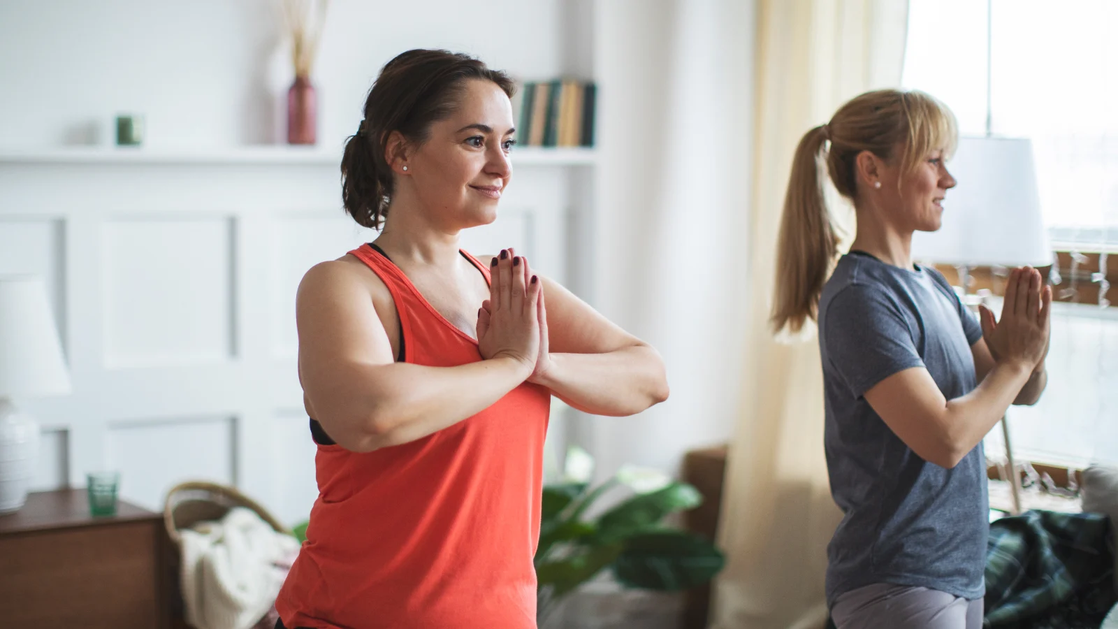 Access to the Peloton App - Two women doing yoga at home