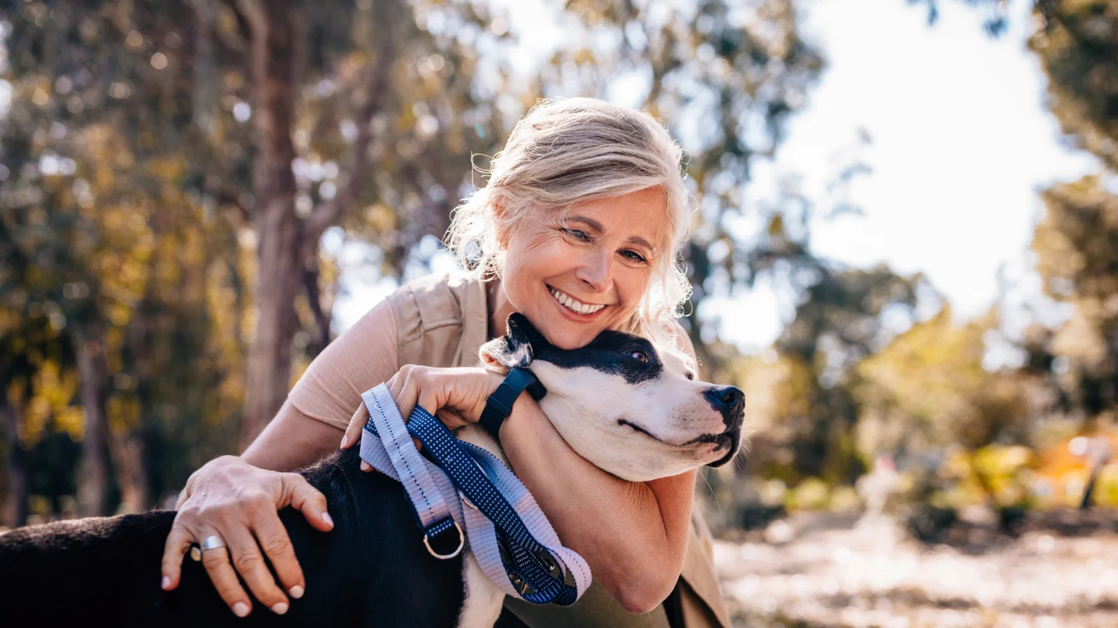 Mature woman outside with her dog