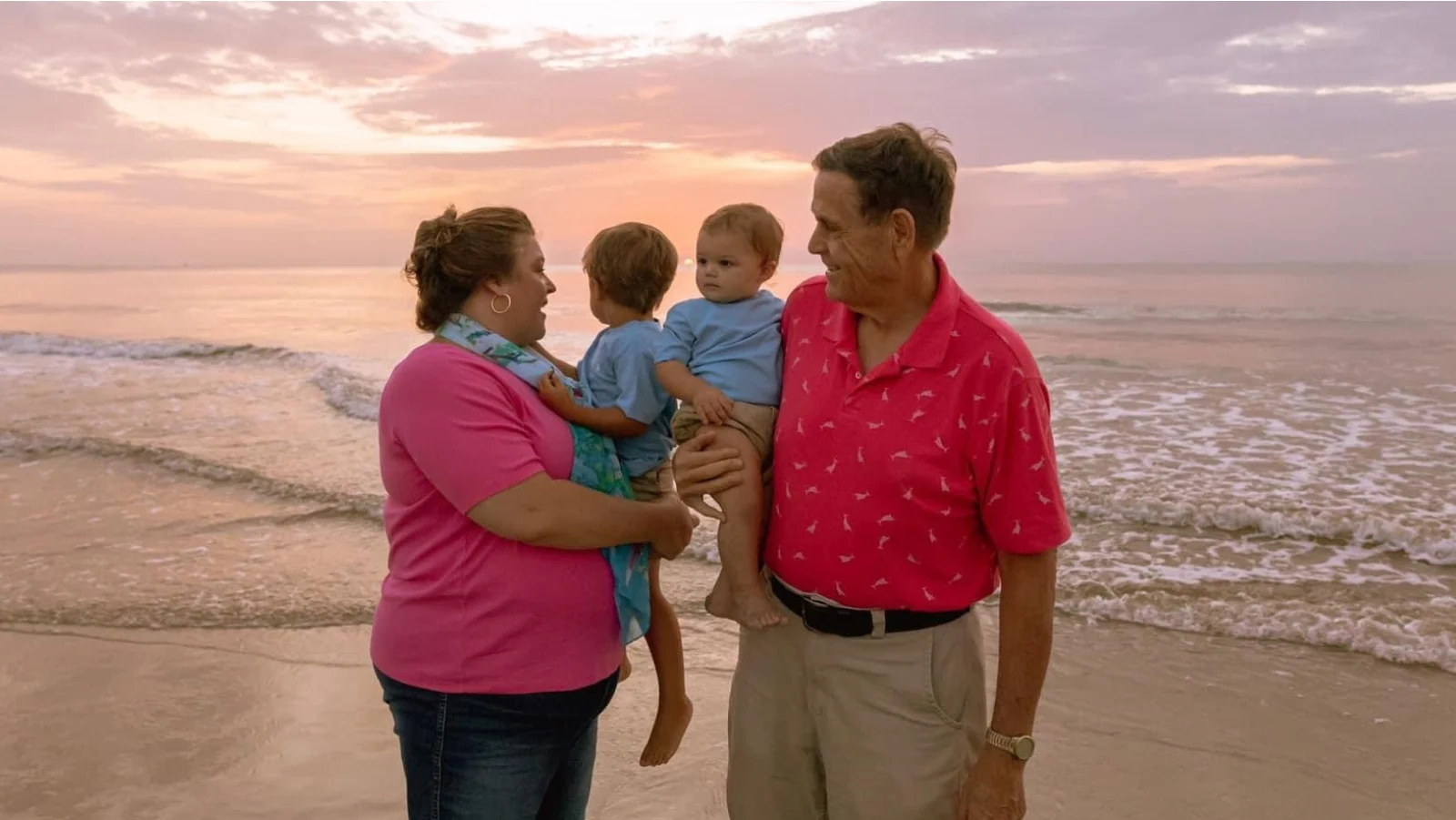 The Hires family walking on the beach