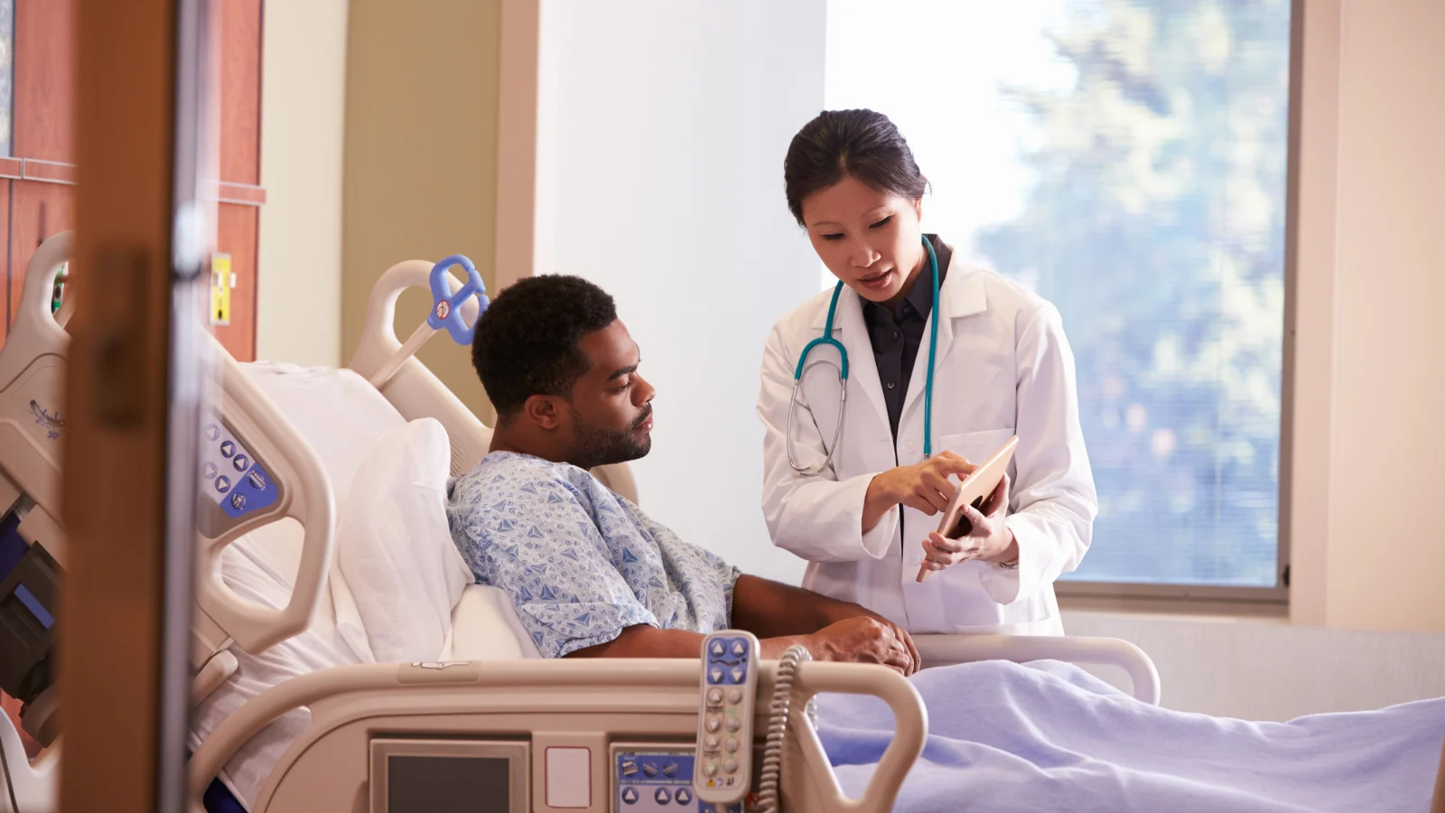 Doctor consulting male patient