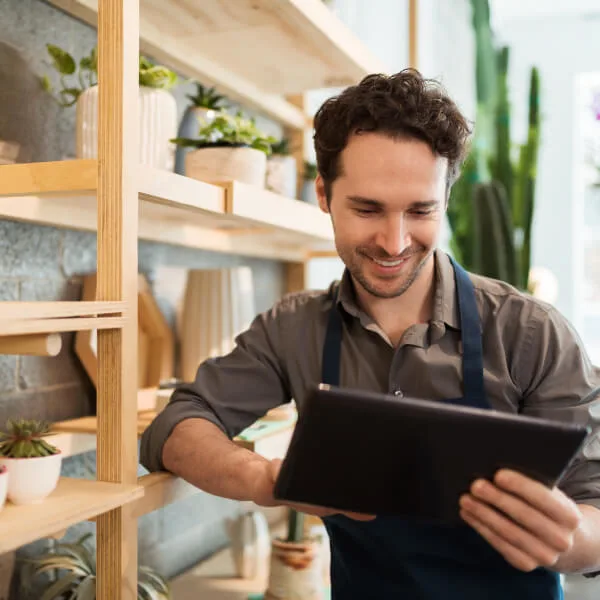 Small business owner learning about digitalizing workplace benefits.